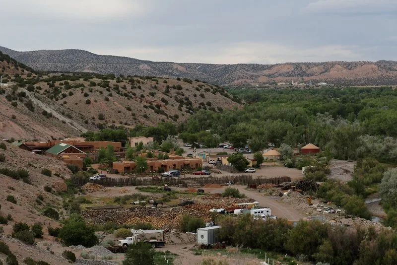 Ojo Caliente resort buildings below the desert cliffs in 2014