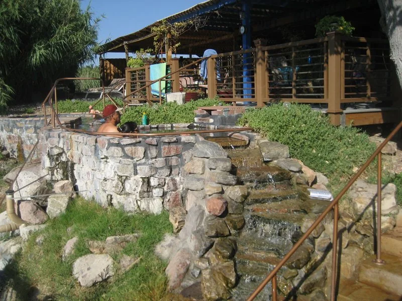 Stone terraces and bathing facilities at Riverbend Hot Springs (archive photograph)