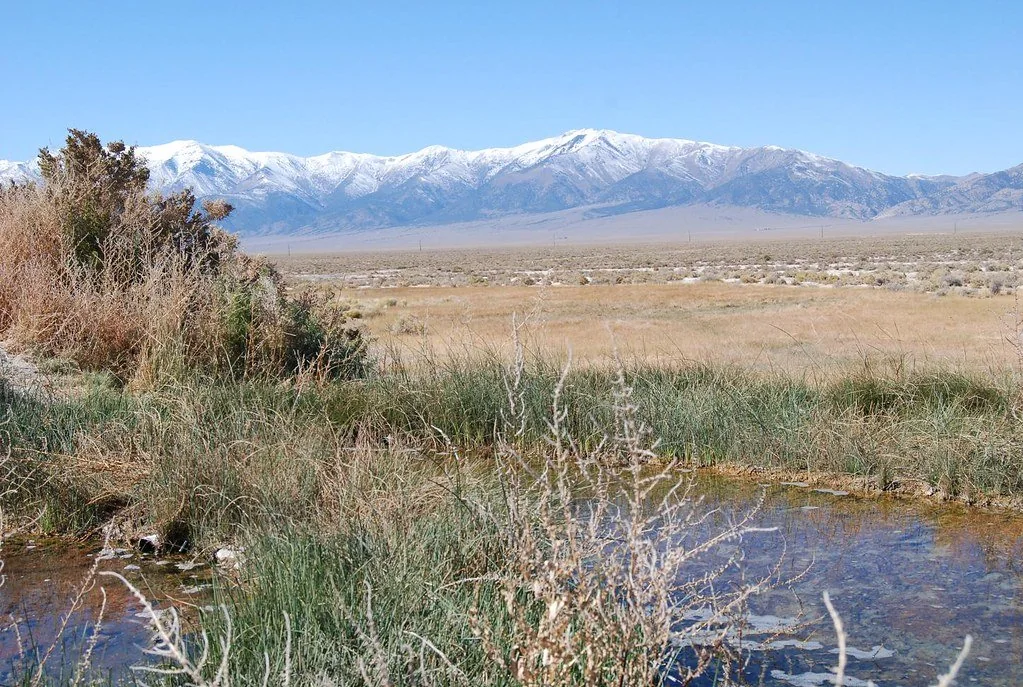 Natural spring pool and mountain setting at Spencer Hot Springs (archive photograph)
